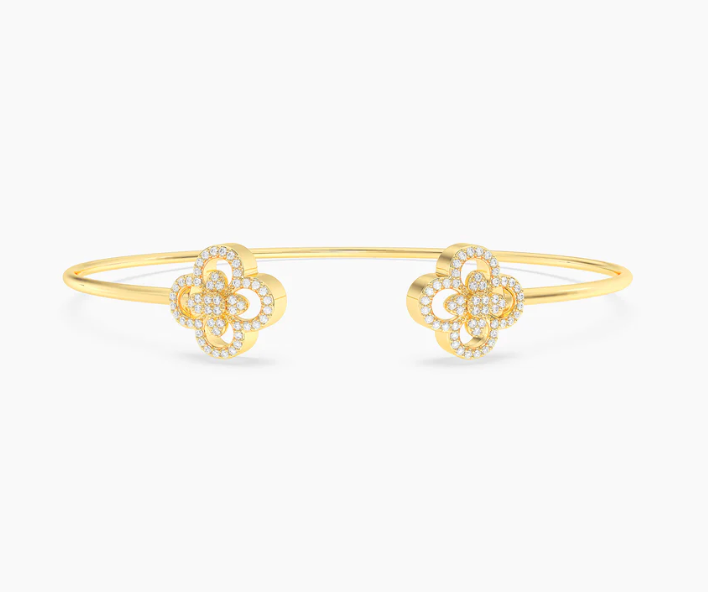 Ella Stein Wildflower Flexi Cuff Bracelet in gold — front flat lay showing open cuff with fully pavé natural diamond clover terminals at each end and slim wire band in gold plating.
