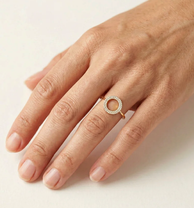 Ella Stein You Are My Everything Statement Ring in gold — on-model hand showing open circle scale on finger, double pavé diamond row, and slim band profile in gold plating.
