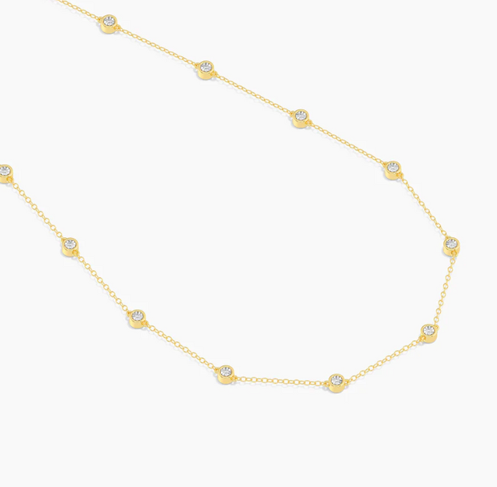 Ella Stein In The Loop Chain Necklace in gold, full chain view showing all bezel-set natural diamond stations on fine cable chain, white background.