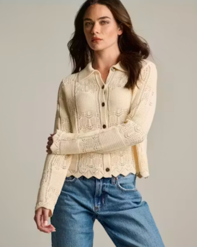 Front on-model — Lisa Todd Checkmate Button Down Cardigan in cream, open crochet-knit cardigan with point collar, worn over denim