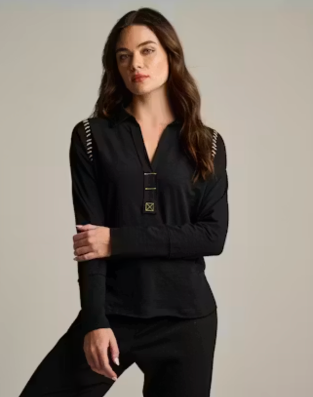 Front on-model — Lisa Todd Whipster Shirt in black, whipstitch trim along shoulder and placket, worn with black trousers