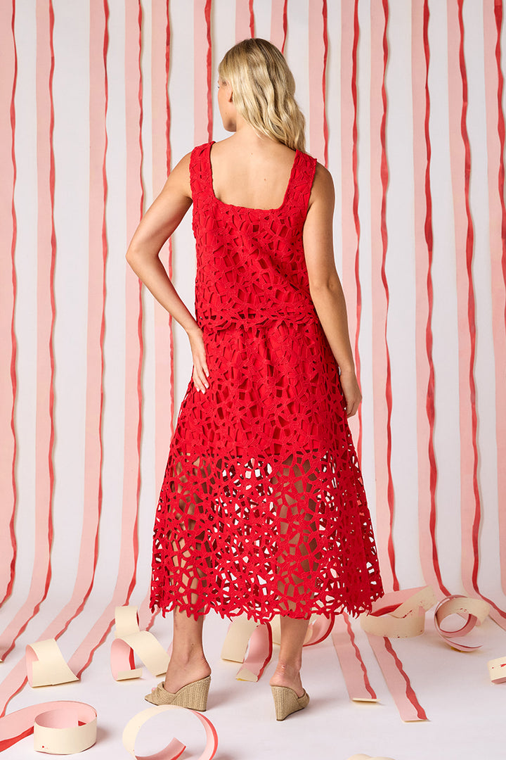 Back view of Crosby Selene Lace Skirt in Pomegranate showing A-line midi silhouette, wide waistband, full geometric crochet lace construction, and open unlined lace at hem.