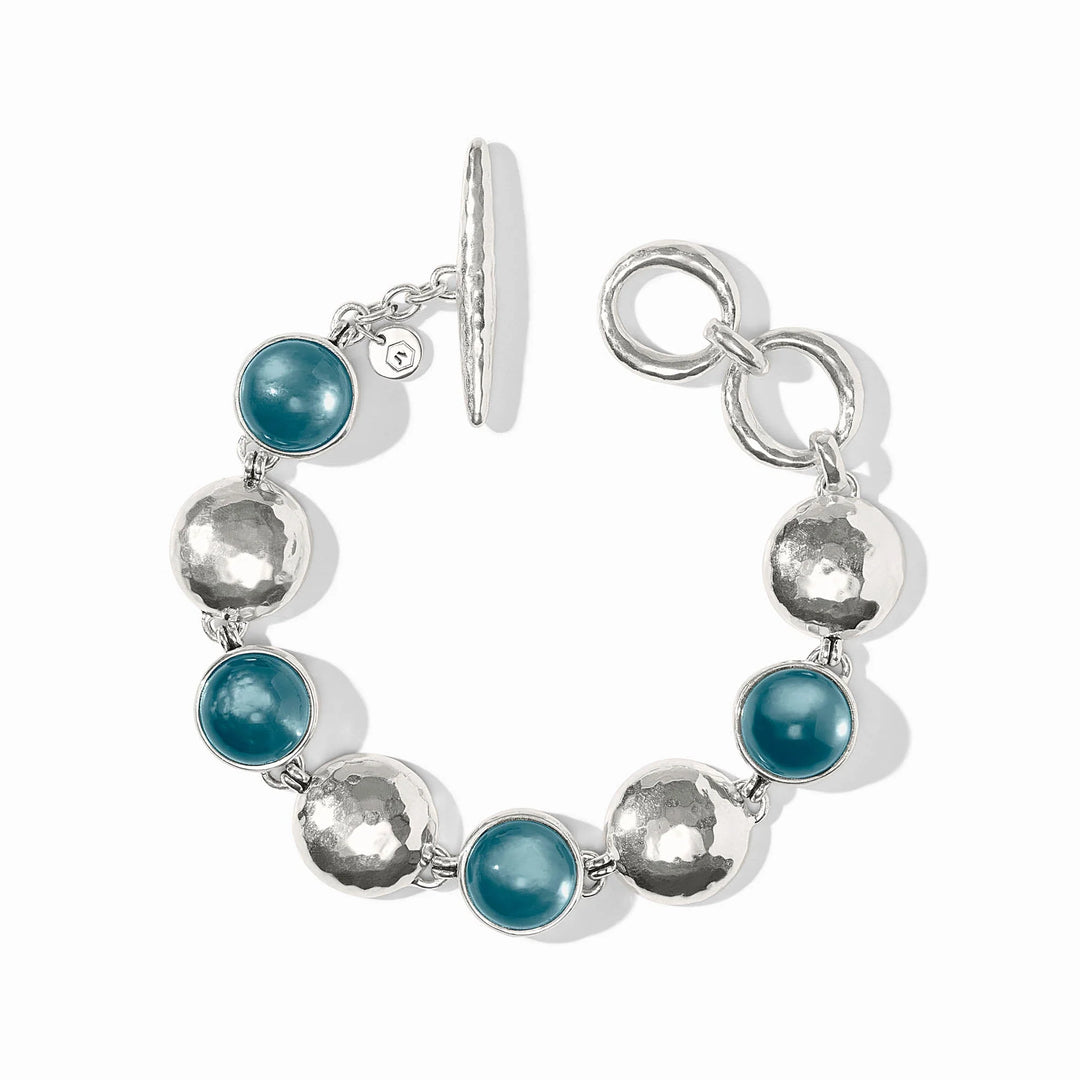 Julie Vos Solara Stone Bracelet in silver plate with iridescent Montana Blue cabochon stones alternating with hammered coin links and toggle closure.