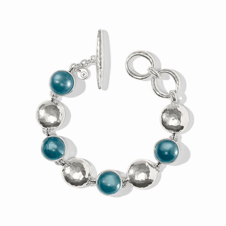 Julie Vos Solara Stone Bracelet in silver plate with iridescent Montana Blue cabochon stones alternating with hammered coin links and toggle closure.
