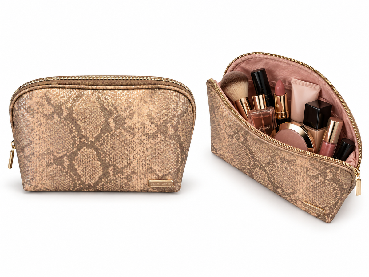 Stephanie Johnson Lola Makeup Bag in Phinda Latte, shown closed in a dome shape with snakeskin-print exterior, and open with end-to-end zip revealing cosmetics held in gusseted side pockets.