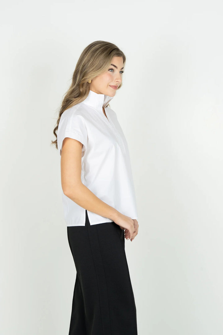 Emily McCarthy Riviera Top in White — side profile on-model, showing dolman sleeve and hem slit