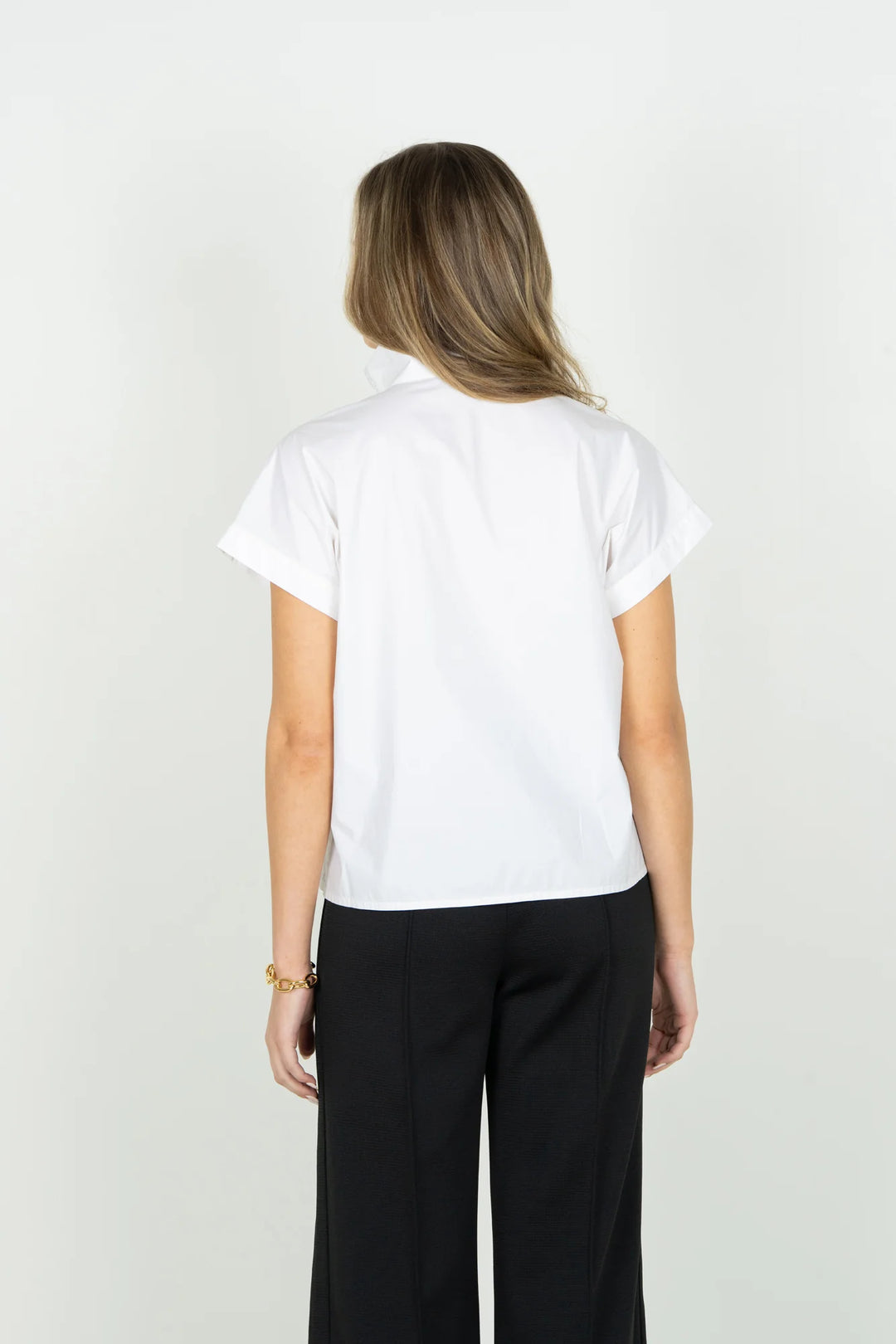 Emily McCarthy Riviera Top in White — back on-model, showing stand collar and clean back silhouette