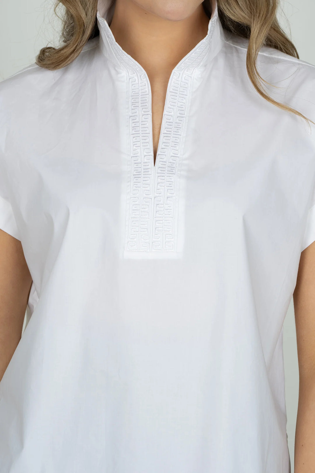 Emily McCarthy Riviera Top in White — detail close-up of embroidered Greek-key trim and split collar