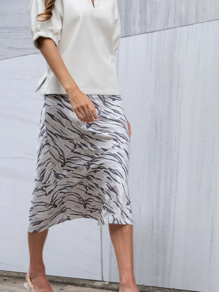 Emily McCarthy Bias Midi Skirt in Wild Marble — lifestyle view styled with ivory blouse