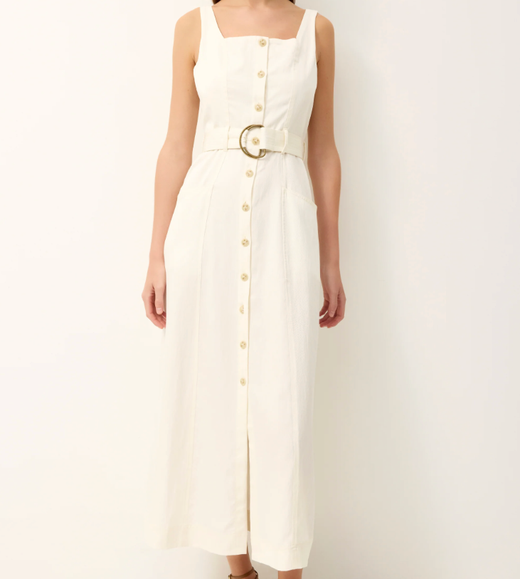 White sleeveless dress with button details on a white background