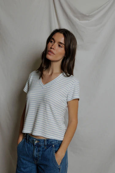 Front view of white and blue stripe brushed v-neck tee showing relaxed cropped silhouette and short sleeve hem, paired with wide-leg denim — perfectwhitetee Elliot Pacific Stripe Tee