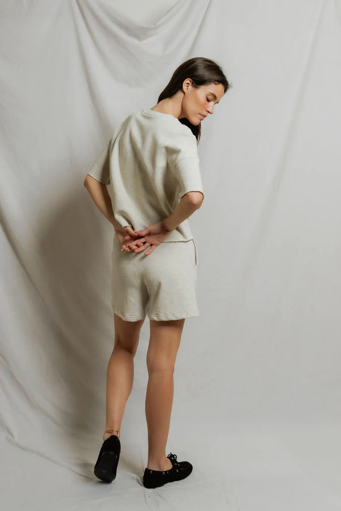 Back of perfectwhitetee Ezra French Terry Short Sleeve Top in Oatmeal, relaxed boxy fit with drop shoulders and rolled hem