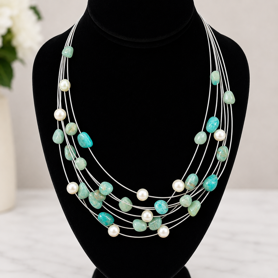 Necklace with amazonite and fresh water pearls on a black mannequin bust.