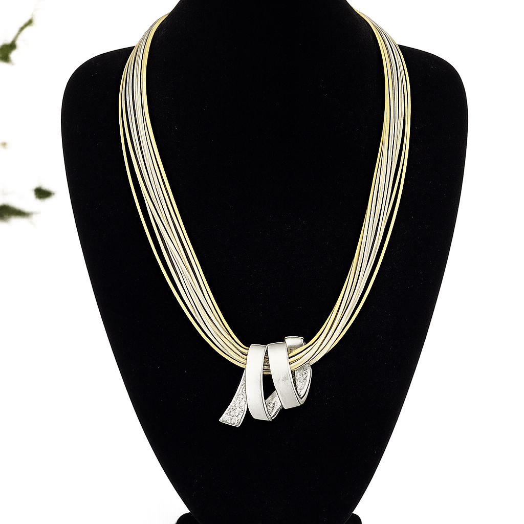 Necklace with multiple strands on a black mannequin bust