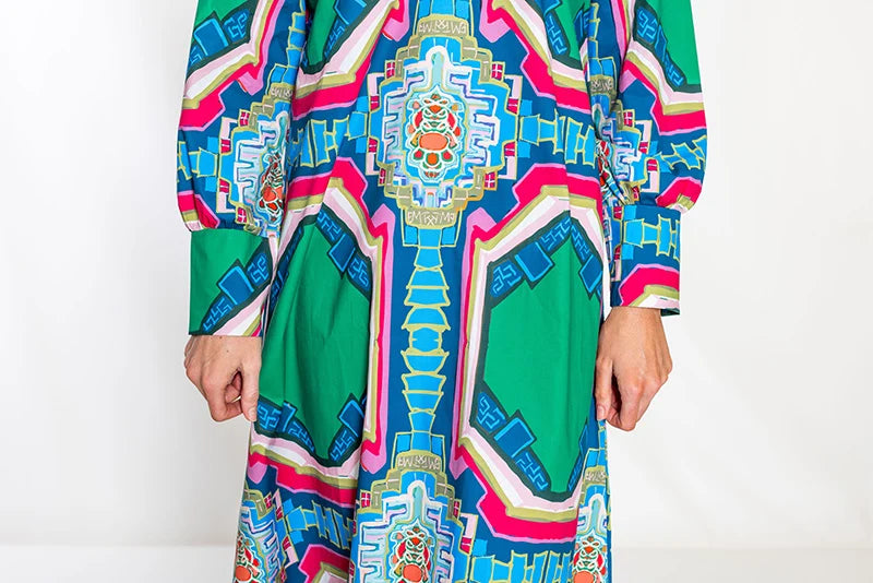 Close-up torso detail: House of MBR Diana Dress Long in Portico© print, close crop on bodice and sleeves showing the centered medallion motif and tailored cuff detail on both sleeves.