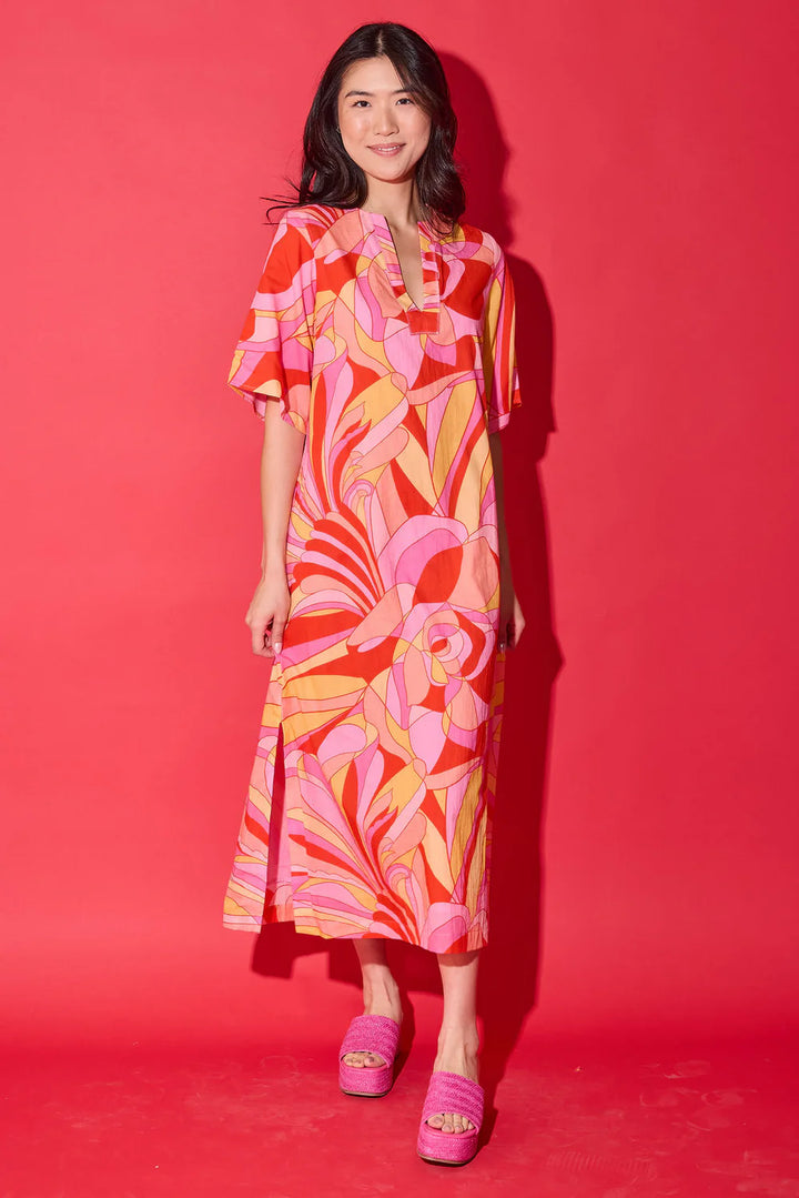 Front view of model wearing the Alden Adair Delaney Dress in Moroccan Poppy, highlighting the abstract floral print.