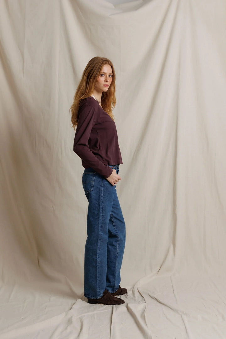 perfectwhitetee Jimi Cotton Long Sleeve Boxy V Neck Tee in Cherry Lacquer, full-length side view on model, showing the boxy silhouette and cropped length