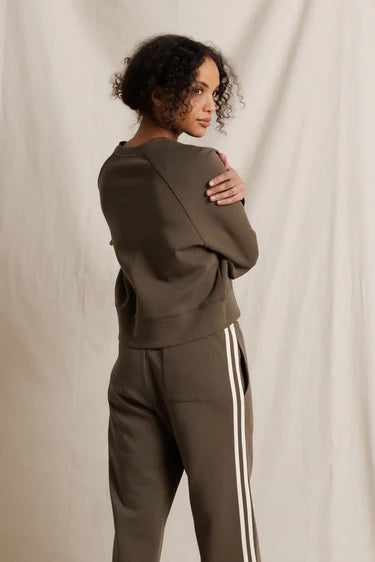 perfectwhitetee Nell Pureform Raglan Sweatshirt in dark olive — back view showing raglan sleeve seaming and cropped length