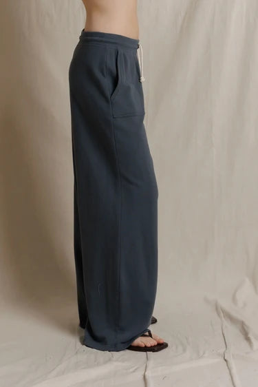 Side profile view showing the straight-leg silhouette from waist to ankle.