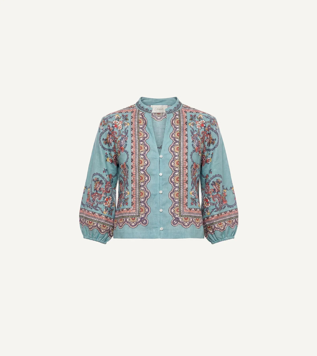 Model wearing teal paisley print, cropped relaxed fit with button-front closure and band collar.