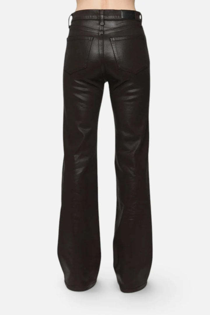 Pistola Evie High Rise Slim Boot in Coated Mocha, back view from the waist down, showing back patch pockets, leather-look waistband patch, and slim line into the boot flare.