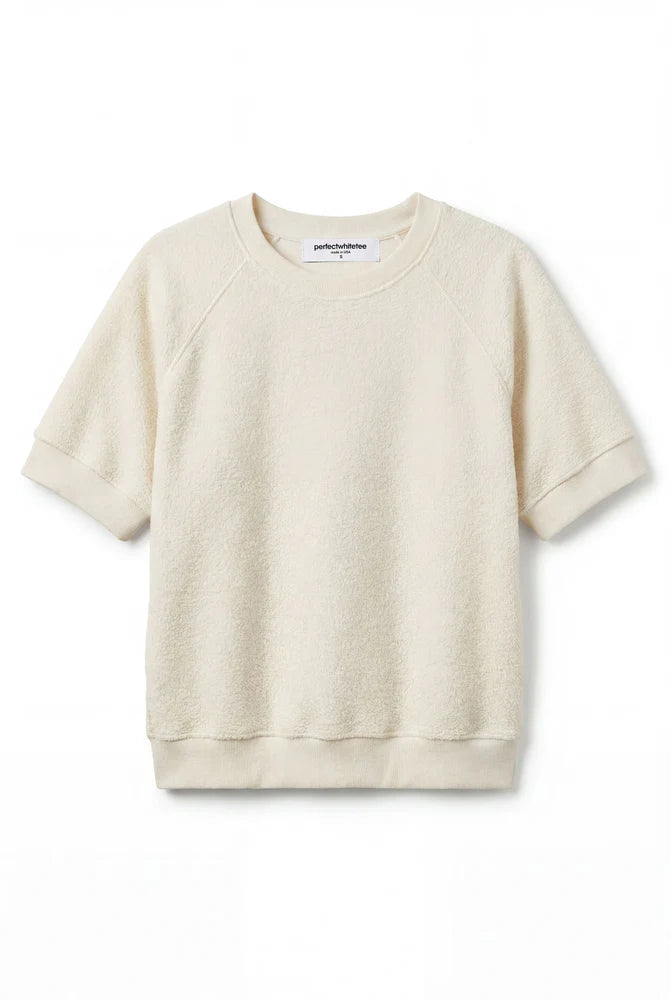 This Kennedy Sweatshirt by perfectwhitetee carries the signature fleece feel into a short-sleeve silhouette — raglan sleeves, a crew neckline, and a relaxed body - shown in flat lay
