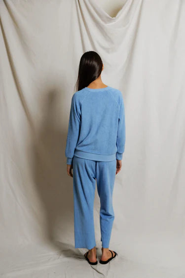 Back view of Pacific blue cropped terry pant showing straight leg silhouette and elasticized drawcord waist, styled as tonal set with matching sweatshirt — perfectwhitetee Eliana Loop Terry Capri Pant