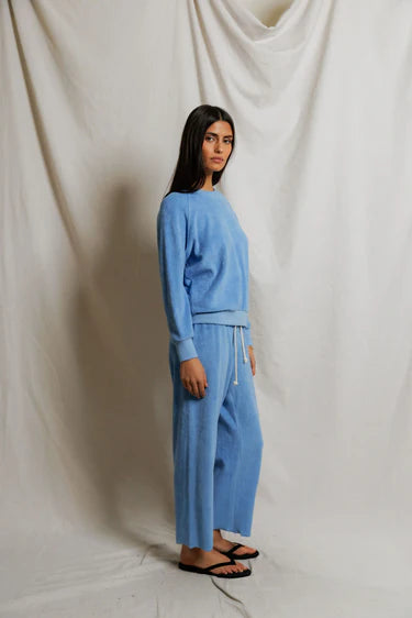 Side view of Pacific blue cropped terry pant showing straight leg silhouette and elasticized drawcord waist, styled as tonal set with matching sweatshirt — perfectwhitetee Eliana Loop Terry Capri Pant