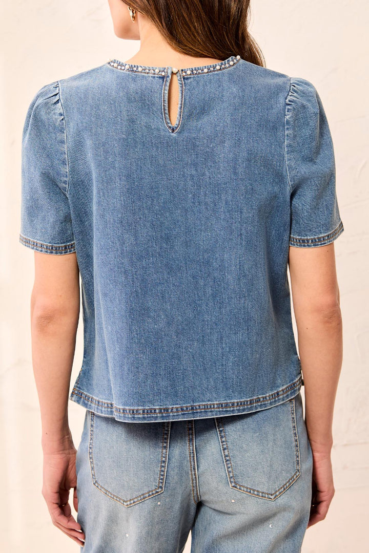 Tribal Denim T-Blouse with Pearls &amp; Stones in Stargazer, back view on model, showing keyhole button closure, pearl-trimmed neckline, gathered shoulders, and side-slit hem.