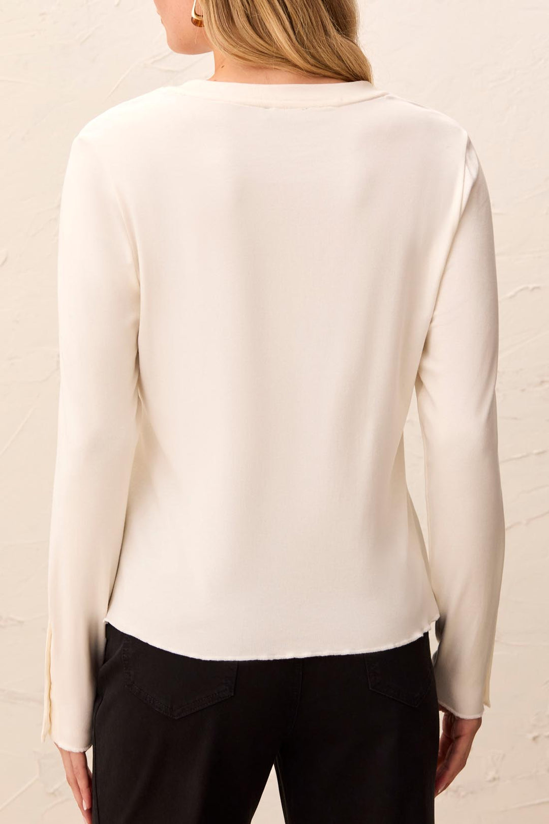 Tribal Long Sleeve Crew Neck Top with Button Detail in Moonstone, back view on model, showing clean back, lettuce-edge hem, and split cuffs.