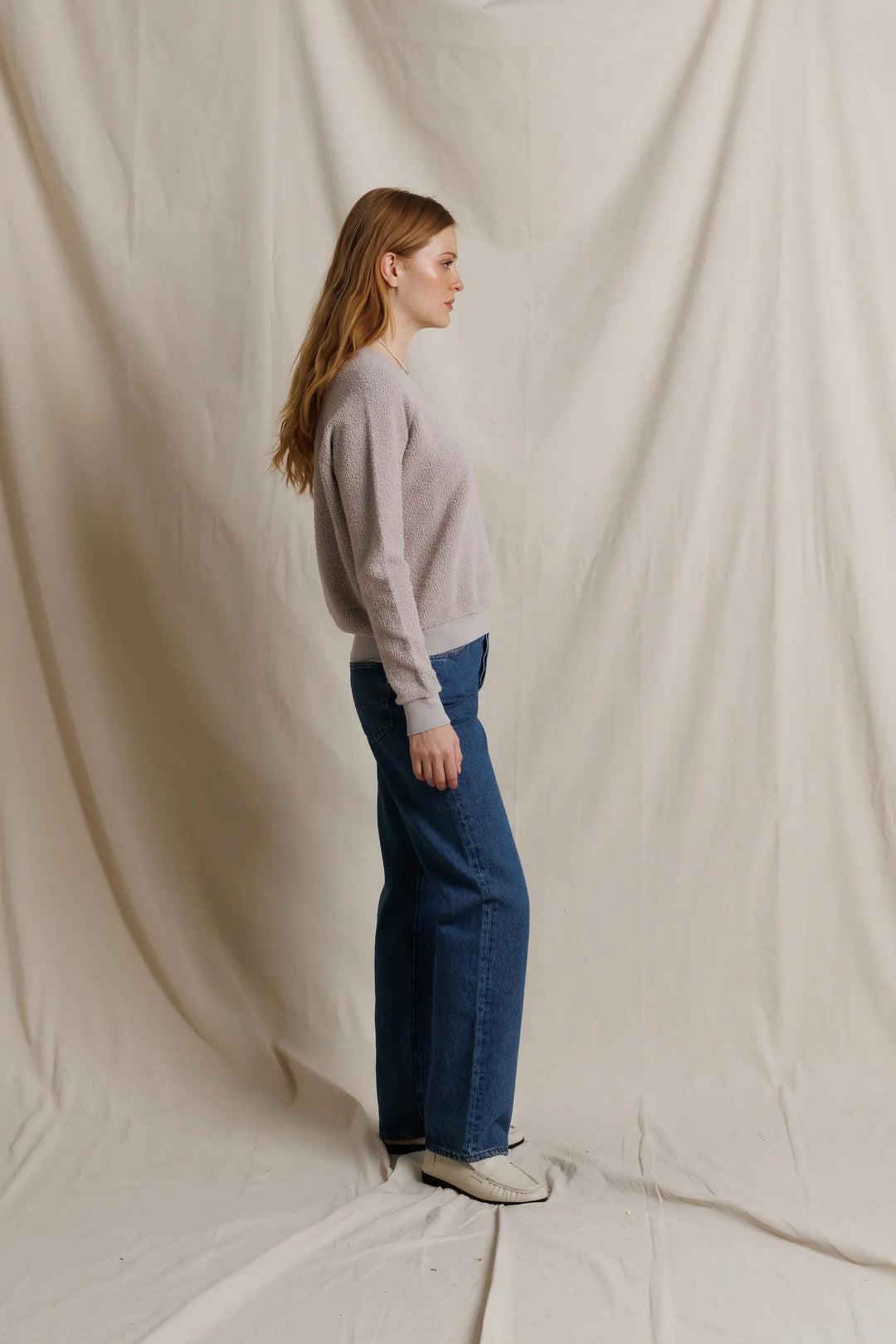 perfectwhitetee Ziggy Inside Out Fleece Sweatshirt in Cloud Gray, full-length side profile on model, showing the relaxed body, sleeve length, and banded ribbed hem