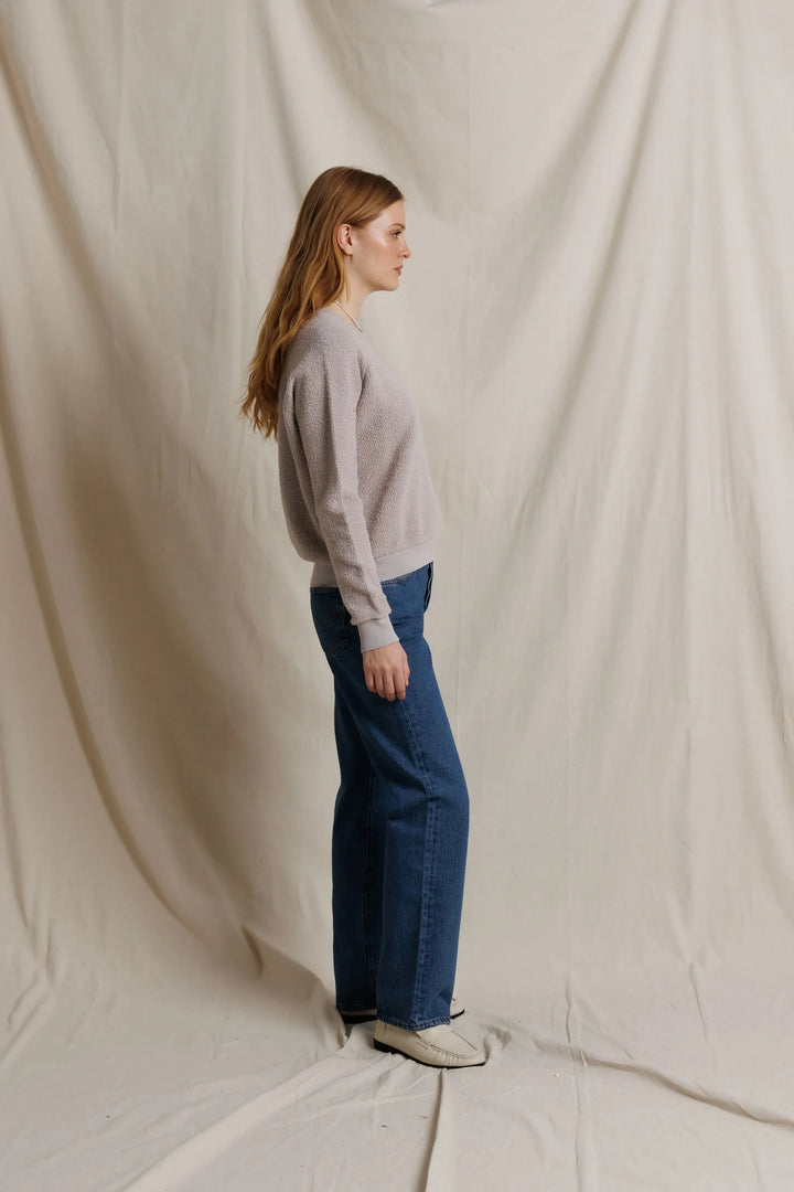 perfectwhitetee Ziggy Inside Out Fleece Sweatshirt in Cloud Gray, full-length side profile on model, showing the relaxed body, sleeve length, and banded ribbed hem